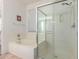 Bathroom features a soaking tub and a glass-enclosed shower at 6431 N 418Th Ave, Tonopah, AZ 85354