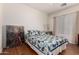 Bedroom with hardwood floors, ceiling fan, and natural light at 6431 N 418Th Ave, Tonopah, AZ 85354