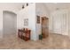 Inviting foyer with tile flooring, display cabinet and art niche at 6431 N 418Th Ave, Tonopah, AZ 85354