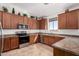 Functional kitchen featuring stainless steel appliances, plenty of storage, and modern lighting at 6431 N 418Th Ave, Tonopah, AZ 85354