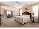 Serene main bedroom featuring comfortable seating, a large bed, and tranquil decor at 6431 N 418Th Ave, Tonopah, AZ 85354