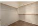 Empty walk-in closet with shelving and carpeted flooring at 6431 N 418Th Ave, Tonopah, AZ 85354