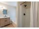 Bathroom featuring a wood-grain vanity, bathtub and a tile surround shower at 6718 E Northridge St, Mesa, AZ 85215