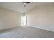 Bright bedroom with neutral walls, plush carpet, and a modern ceiling fan at 6718 E Northridge St, Mesa, AZ 85215