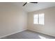 Bedroom featuring neutral walls, carpet floors, ceiling fan and a window providing natural light at 6718 E Northridge St, Mesa, AZ 85215