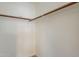 A functional closet features wood railing, white walls, and offers ample storage at 6718 E Northridge St, Mesa, AZ 85215