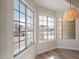 Bright dining area featuring three large windows overlooking the neighborhood with modern pendant lighting at 6718 E Northridge St, Mesa, AZ 85215