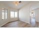 Bright dining room with wood floors with view to patio and kitchen at 6718 E Northridge St, Mesa, AZ 85215