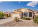 Beautiful home exterior with a two-car garage, desert landscaping, and a charming entrance at 6718 E Northridge St, Mesa, AZ 85215