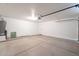 Spacious garage with a concrete floor and water heater in the corner at 6718 E Northridge St, Mesa, AZ 85215