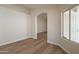 Bright living room with wood floors and window features security door at 6718 E Northridge St, Mesa, AZ 85215