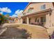 Expansive backyard view of home's exterior, patio, and green space, perfect for outdoor activities at 6812 S 45Th Ave, Laveen, AZ 85339