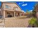 Beautiful backyard area featuring gravel landscaping, mature trees, and partial home exterior at 6812 S 45Th Ave, Laveen, AZ 85339