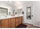 Bathroom with dual sinks and oak cabinets at 6812 S 45Th Ave, Laveen, AZ 85339