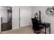 Bedroom with a closet, an office area with a desk, and a view of the upstairs hallway at 6812 S 45Th Ave, Laveen, AZ 85339