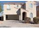 Stunning two-story home with a neutral stucco exterior and an open two-car garage at 6819 S 38Th Dr, Phoenix, AZ 85041