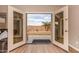 A backyard view through the doors highlights outdoor living and landscaped yard at 700 W Gascon Rd, San Tan Valley, AZ 85143