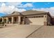 Charming single-story home with a well-manicured front yard and a two-car garage in a quiet neighborhood at 700 W Gascon Rd, San Tan Valley, AZ 85143