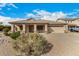 Charming single-story home with a well-manicured front yard and a two-car garage in a quiet neighborhood at 700 W Gascon Rd, San Tan Valley, AZ 85143