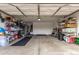 Spacious and organized garage with ample storage shelves, offering a functional space for parking and projects at 700 W Gascon Rd, San Tan Valley, AZ 85143