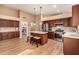 Open kitchen featuring stainless steel appliances, wooden cabinets and walk-in pantry at 700 W Gascon Rd, San Tan Valley, AZ 85143