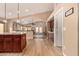 Open kitchen with wood floors seamlessly transitions into the living space, promoting a social and connected atmosphere at 700 W Gascon Rd, San Tan Valley, AZ 85143