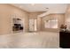 Bright living room with carpeted floors, ample natural light, and neutral color scheme at 700 W Gascon Rd, San Tan Valley, AZ 85143