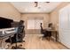 Functional home office featuring multiple workstations and lots of natural light at 700 W Gascon Rd, San Tan Valley, AZ 85143