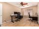 Bright home office with ceiling fan, great natural light, and functional design at 700 W Gascon Rd, San Tan Valley, AZ 85143