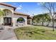 The backyard features desert landscaping, a grassy area, a stucco wall and a lovely patio set at 718 E Tuckey Ln, Phoenix, AZ 85014