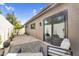 Back patio showcases a cozy outdoor seating arrangement and seamlessly blends into the surrounding landscape at 718 E Tuckey Ln, Phoenix, AZ 85014