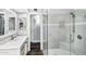 Modern bathroom featuring a glass enclosed shower, neutral tile, and updated vanity at 718 E Tuckey Ln, Phoenix, AZ 85014