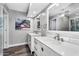 Elegant bathroom with double vanity, modern lighting, and luxury finishes at 718 E Tuckey Ln, Phoenix, AZ 85014