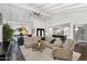 Open concept living space with vaulted ceilings, modern furnishings, and seamless flow to the kitchen at 718 E Tuckey Ln, Phoenix, AZ 85014