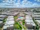 Community aerial view highlighting a central pool area, landscaping, and nearby residences at 7436 E Chaparral Rd # B103, Scottsdale, AZ 85250