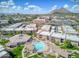 Aerial view showcases the community with pool, lush landscaping and mountain backdrop at 7436 E Chaparral Rd # B103, Scottsdale, AZ 85250