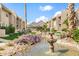 Landscaped exterior with fountain and mountain views at 7436 E Chaparral Rd # B103, Scottsdale, AZ 85250