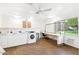 Bright laundry room with modern washing machines, folding space, and natural light at 7436 E Chaparral Rd # B103, Scottsdale, AZ 85250