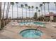 Inviting community pool and spa area with lounge chairs providing a relaxing outdoor experience at 8651 E Royal Palm Rd # 206, Scottsdale, AZ 85258