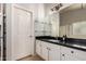 A bathroom with a vanity with mirror and shelving plus a door to closet and bathroom at 9212 W Salter Dr, Peoria, AZ 85382