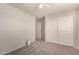 This is a bedroom with gray walls and gray carpet plus a closet and doorway at 9212 W Salter Dr, Peoria, AZ 85382