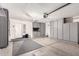 Garage with gray cabinets for storage and an automatic garage door opener at 9212 W Salter Dr, Peoria, AZ 85382