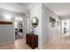 Inviting hallway with tile flooring, neutral paint, and decorative accents at 9212 W Salter Dr, Peoria, AZ 85382