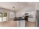 Modern kitchen features granite countertops, stainless steel appliances, and a center island at 9212 W Salter Dr, Peoria, AZ 85382