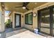 Covered patio with ceiling fan and string lights; features a door to the backyard at 9212 W Salter Dr, Peoria, AZ 85382