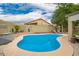 Sparkling pool in a private backyard with desert landscaping and lounge chairs, ideal for relaxation at 9212 W Salter Dr, Peoria, AZ 85382