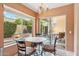 Charming breakfast nook with a chandelier and large windows offering views of the outdoor patio at 9445 N 106Th St, Scottsdale, AZ 85258