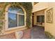 Home entrance featuring a large picture window and stone accents at 9445 N 106Th St, Scottsdale, AZ 85258