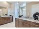 Bathroom with double vanity, granite countertops, and a large mirror at 974 W Saddle Run, Apache Junction, AZ 85120