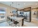 Modern kitchen featuring an island with bar stool seating and stainless steel appliances at 974 W Saddle Run, Apache Junction, AZ 85120